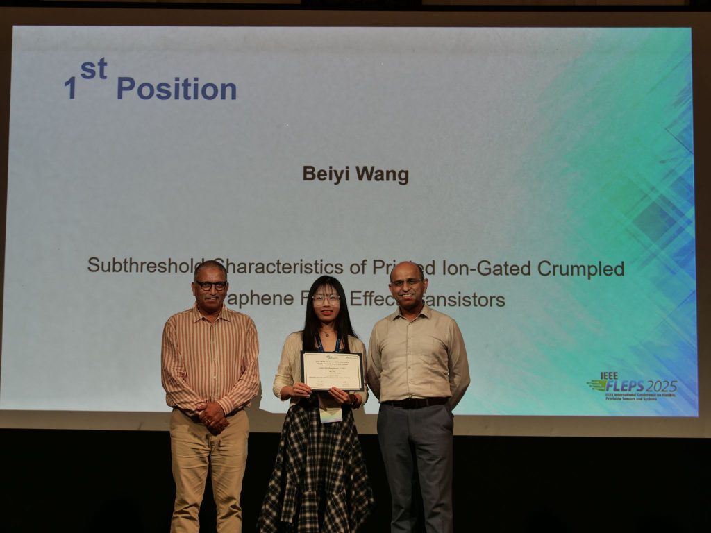 Beiyi (middle) receiving the top student paper award
